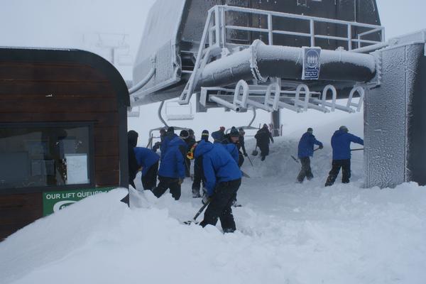 Mt Hutt lifties dig out a lift station on the mountain following a snowstorm that delivered 80cm of powder